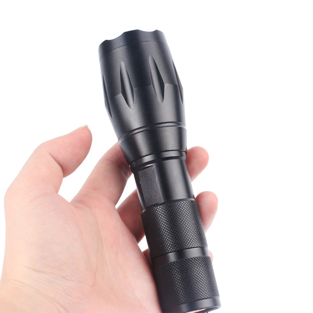 Compact FL5004 flashlight held in one hand